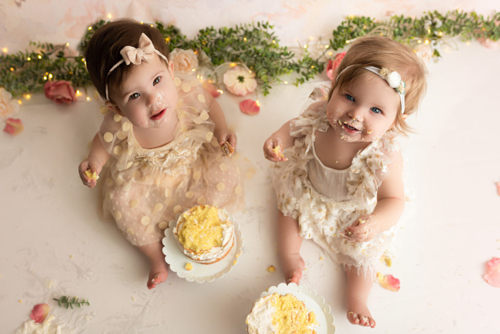 Twin Girls at Charlotte Cake Smash session looking at the camera
