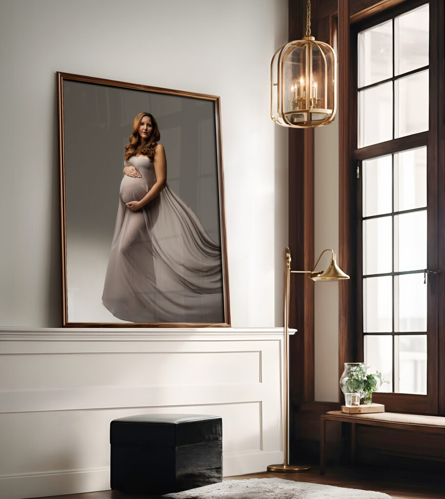 Framed maternity portrait of expectant mother in gray gown displayed as wall art in a Charlotte, NC home.