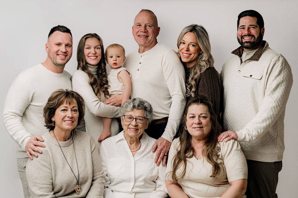 Extended family portrait with three generations including great grandmother grandparents parents and baby boy at NicSo Studio Waxhaw NC