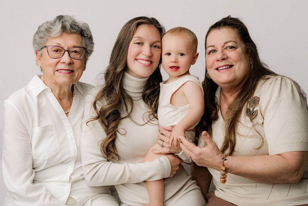 Three generation portrait of great grandmother grandmother mother and baby boy at NicSo Studio family session in Waxhaw NC